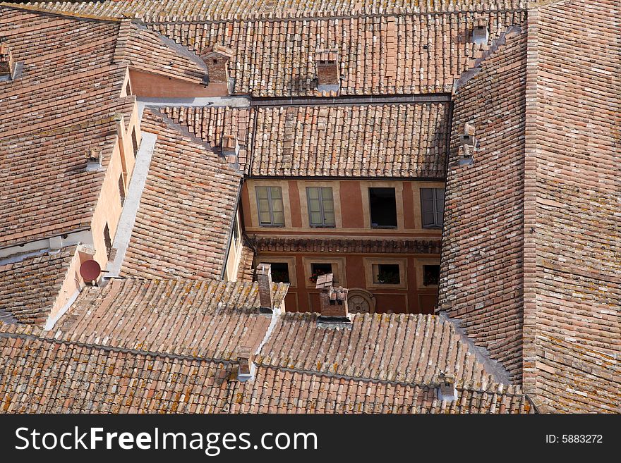 Roof top of the rocca salimbeni from the the tower of palazzo pubblico torre del mangia siena tuscany southern italy europe