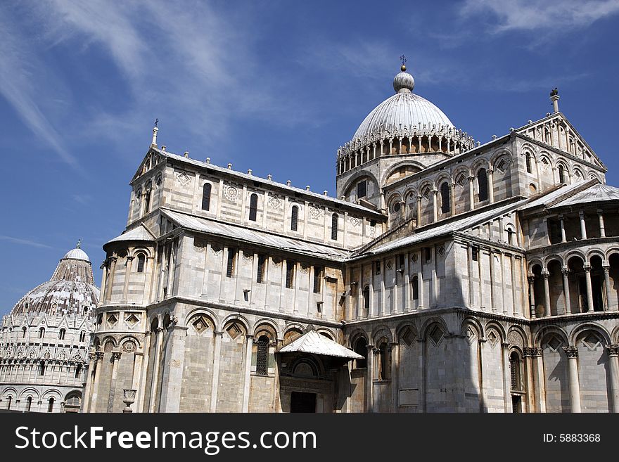 Exterior of the duomo with the baptistry behind campo dei miracoli pisa italy tuscany europe