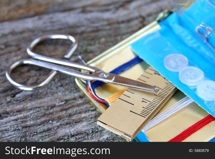 Close up of some items from a sewing kit.