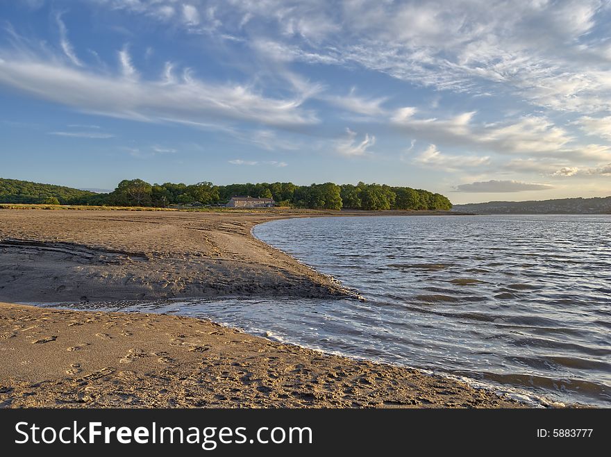 A secluded bay near Arnside, North West England.Cirrus clouds fill the sky. A secluded bay near Arnside, North West England.Cirrus clouds fill the sky