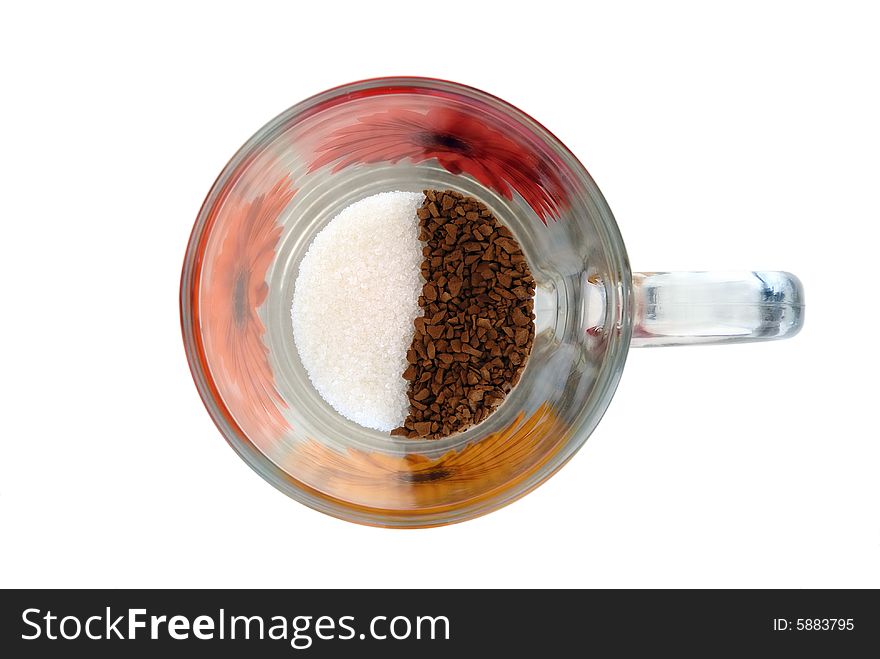 Instant coffee and sugar in glass cup isolated