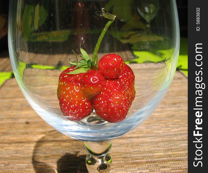 Unusual strawberry at the bottom of the glass. Unusual strawberry at the bottom of the glass