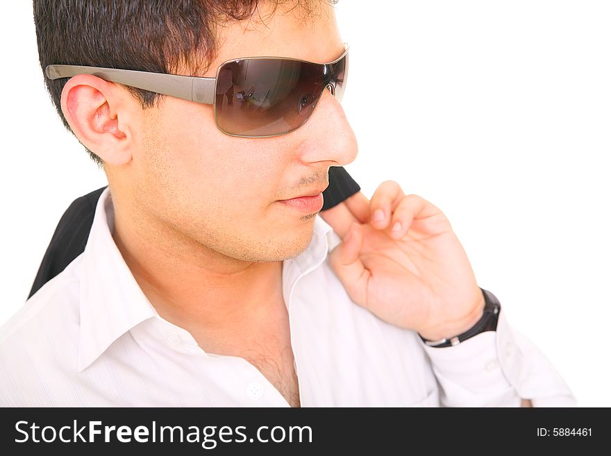 Relax fashion model wearing sunglasses, carrying his suit over the shoulder. isolated on white background. Relax fashion model wearing sunglasses, carrying his suit over the shoulder. isolated on white background