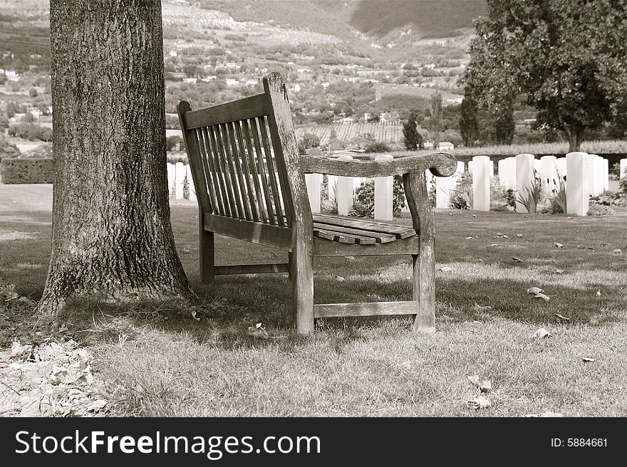 This is a bench on a cemetery war. This is a bench on a cemetery war