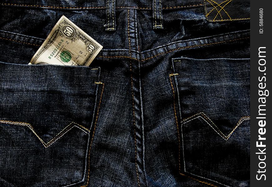 Dollar bill in back pocket jeans