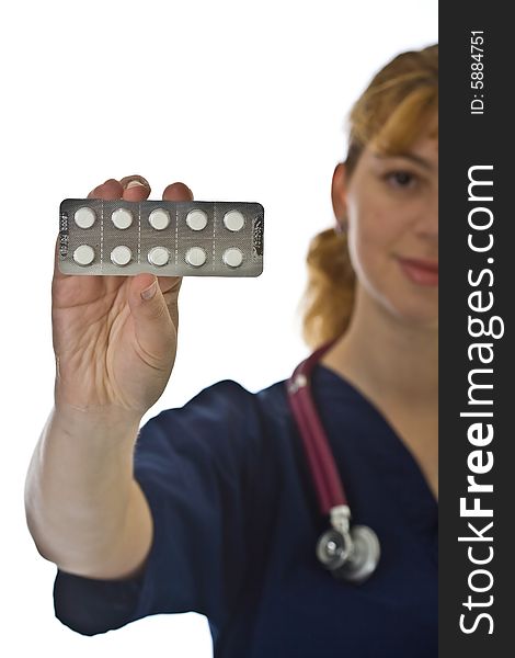 Young female doctor with stethoscope and tablets over white background. Young female doctor with stethoscope and tablets over white background