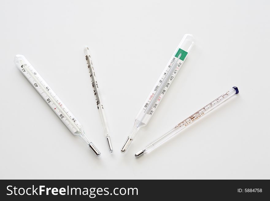 Medical mercury thermometers on white background