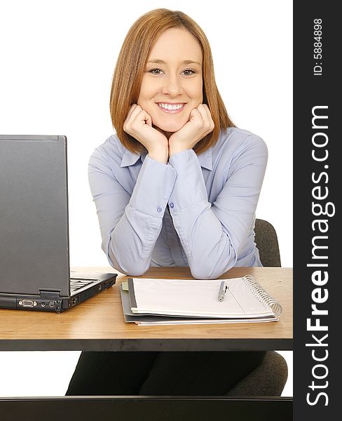 Beautiful and happy young woman in casual dress smile and resting her hand on table. Beautiful and happy young woman in casual dress smile and resting her hand on table