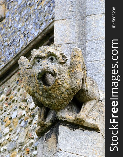 Shot of a stone gargoyle on a chuch wall