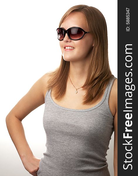 Portrait of young girl in sunglasses and tank top. Portrait of young girl in sunglasses and tank top