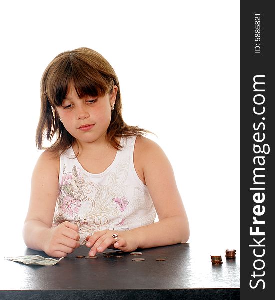 Elementary girl sad because the money she's counting isn't enough for what she wants. Elementary girl sad because the money she's counting isn't enough for what she wants.