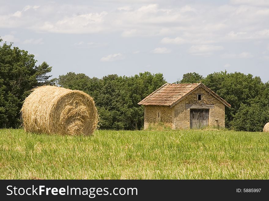 Cottage And Haystacks