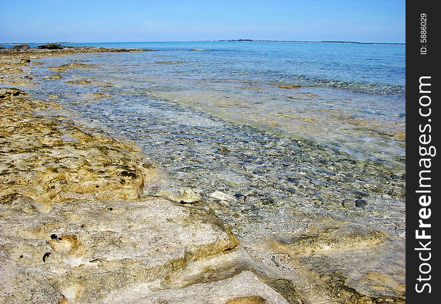 Shallow beach waters in Nassau town, The Bahamas. Shallow beach waters in Nassau town, The Bahamas.