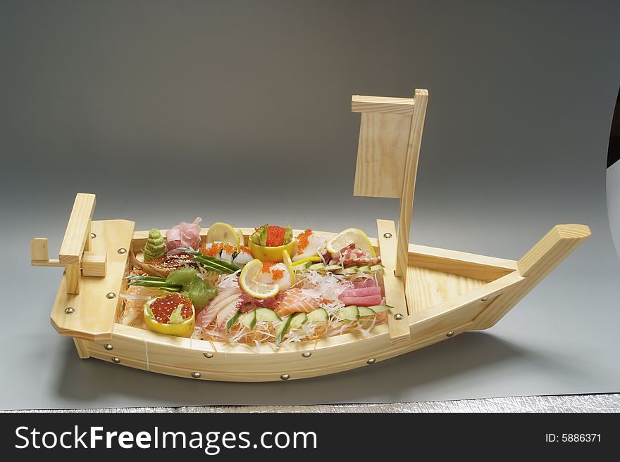 Sushi on wood plate boat