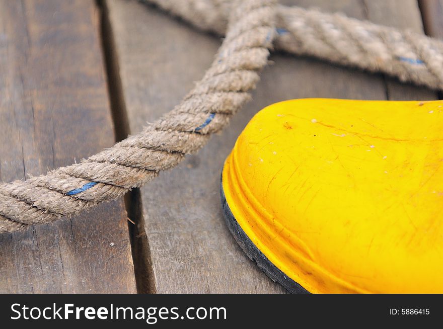 An abstract image of yellow boots with ropes. An abstract image of yellow boots with ropes