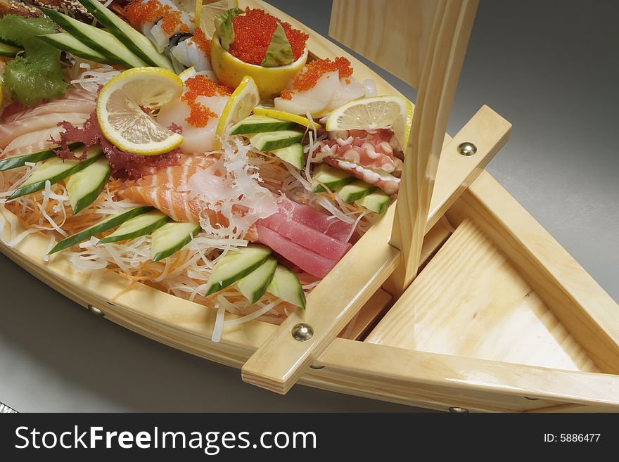Sushi on wood plate-boat