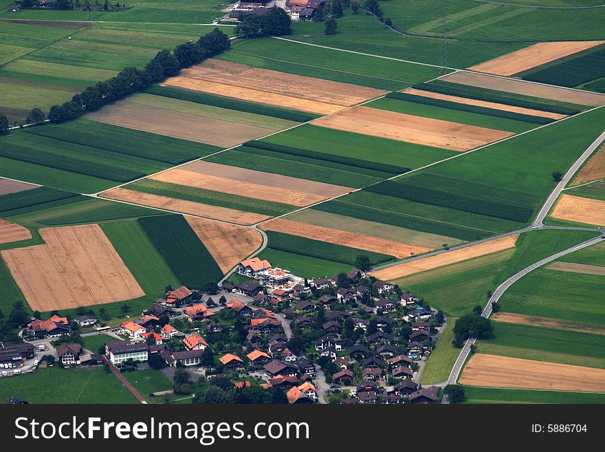 Cultivated fields and farmhouses, small village, Switzerland. Cultivated fields and farmhouses, small village, Switzerland