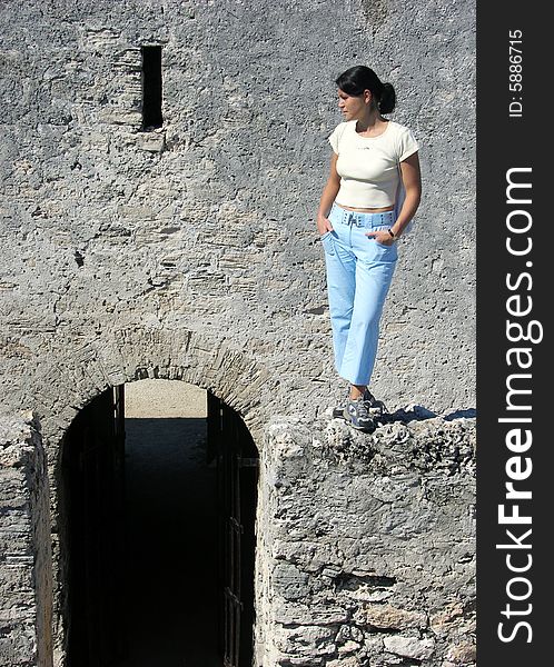 The girl standing on a wall of historical XVIII century Montagu fort in Nassau, the capital of The Bahamas.