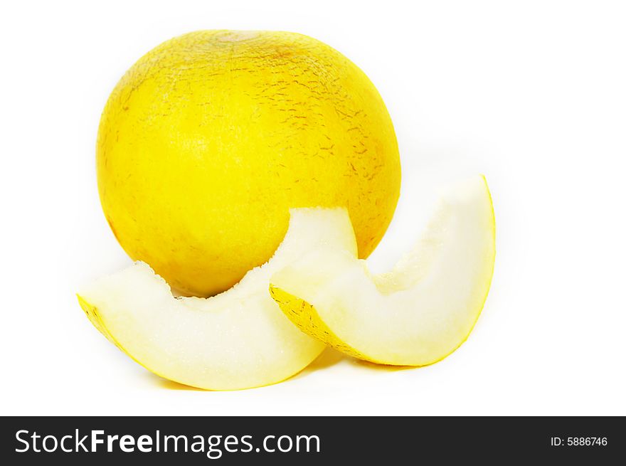 Yellow ripe melon and two slices on white