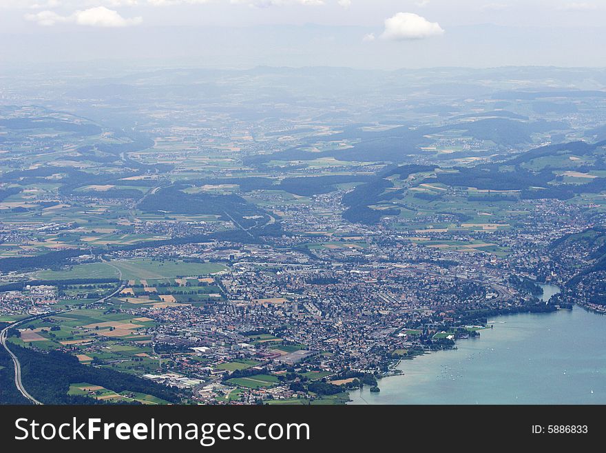 Top-view from nearest mountains on city Thun and environments and lake Thunersee, Switzerland. Top-view from nearest mountains on city Thun and environments and lake Thunersee, Switzerland