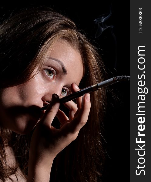 Beauty Girl Smoke Cigarette Holder. Isolated on Black Background. Beauty Girl Smoke Cigarette Holder. Isolated on Black Background