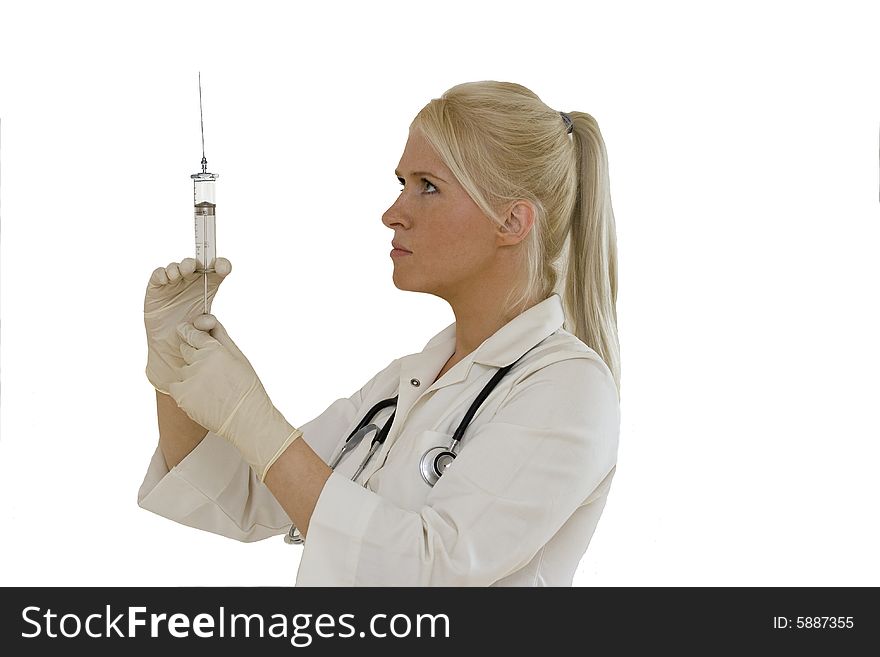 A young female doctor/nurse  prepares to make an injection isolated on white backgroun