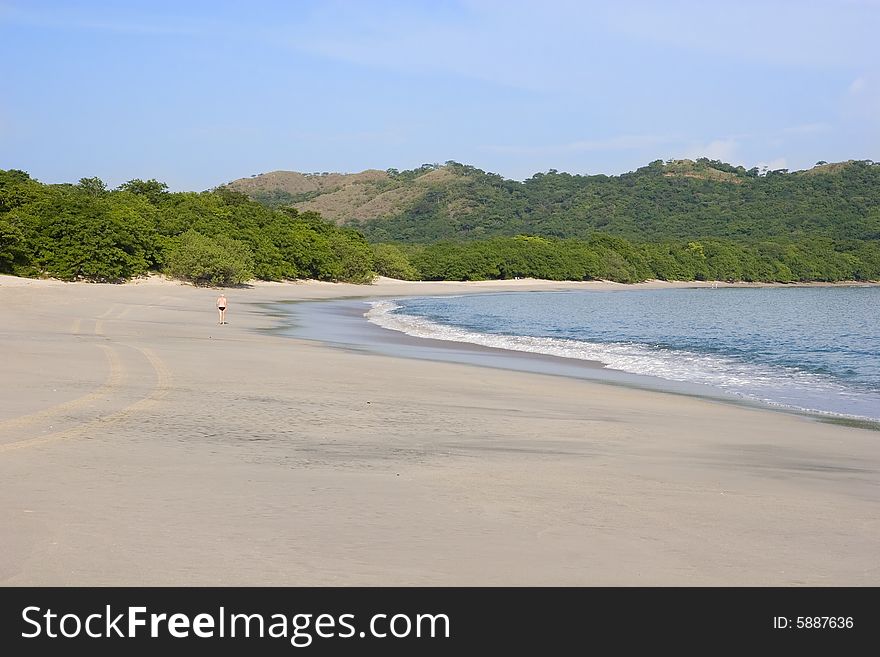 Lone Runner On Beach