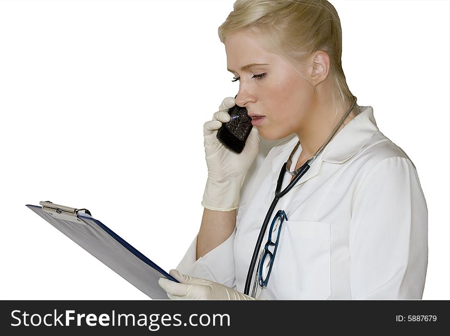 A young female doctor/nurse talking over the phone. A young female doctor/nurse talking over the phone