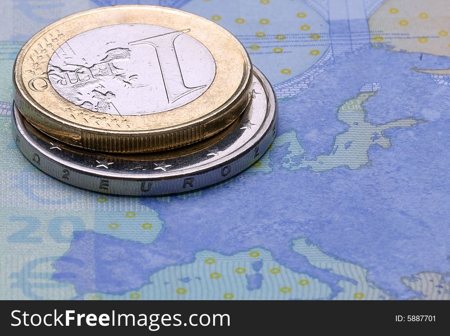 Close-up of some euros - banknote and coins. Close-up of some euros - banknote and coins.