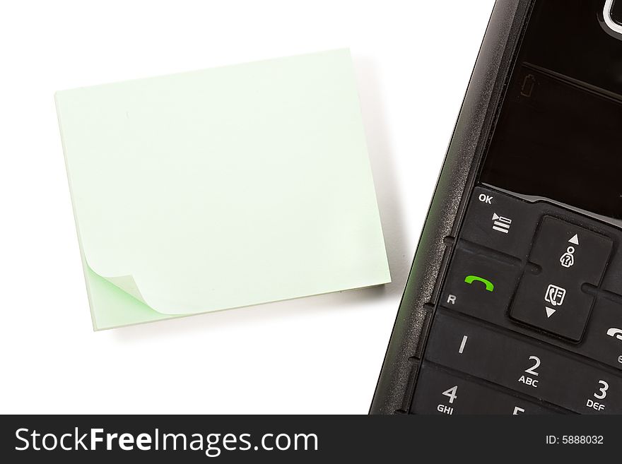 Blank stick note page with black dect phone handset