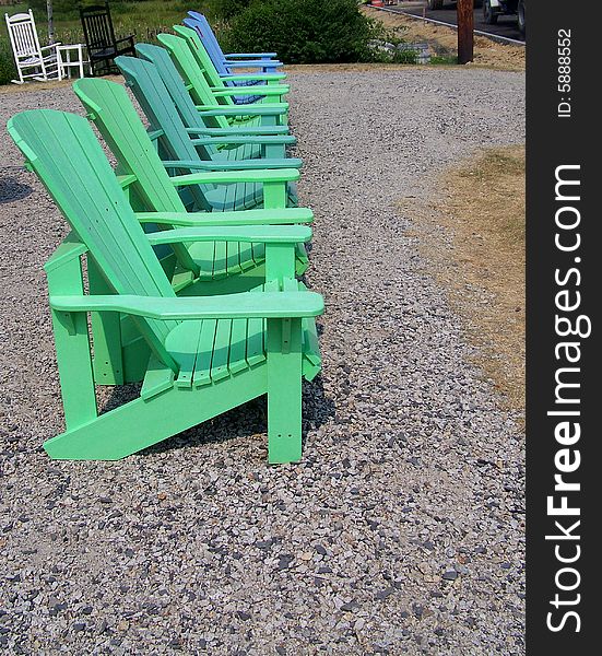 A row of Adirondack chairs are lined up waiting
for anyone to sit a spell and be comfortable. A row of Adirondack chairs are lined up waiting
for anyone to sit a spell and be comfortable.