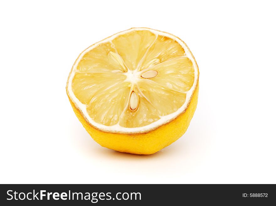 A withered half lemon isolated on white background.