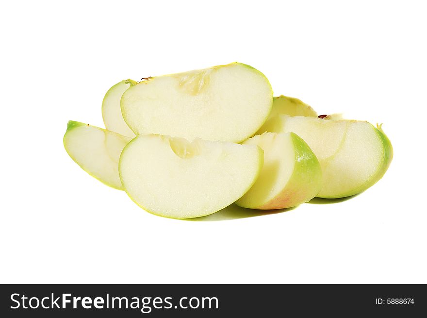 Pieces of a green apple isolated on a white background