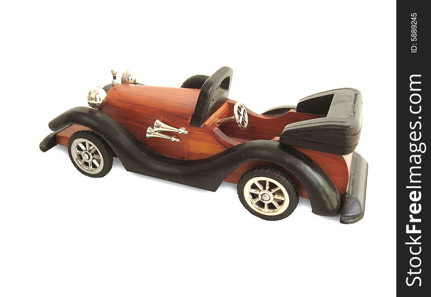 Colored wooden old car toy on a white background