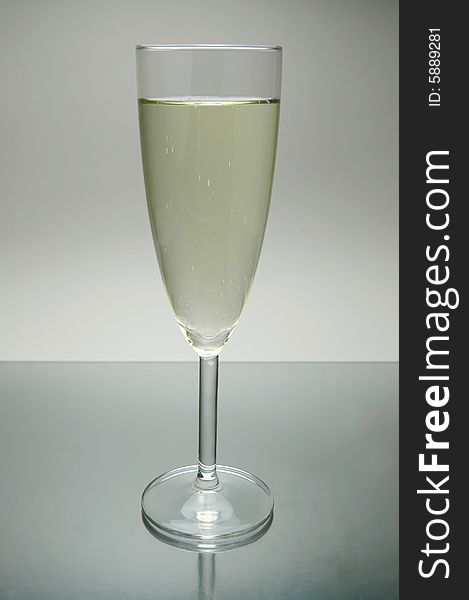 Flutes of sparkling wine isolated against a white background