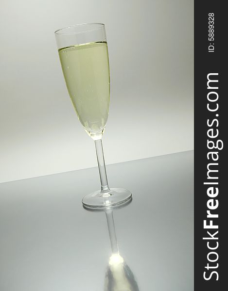 Flutes of sparkling wine isolated against a white background