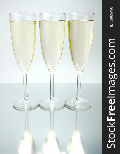 Flutes of sparkling wine isolated against a white background