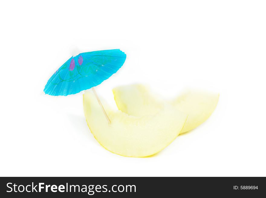 Two melon slices with umbrella isolated on white