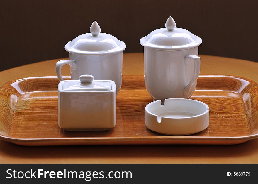 Tea cup and ashtray on the table