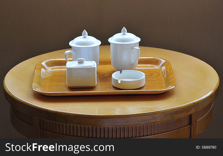 Tea cup and ashtray on the table