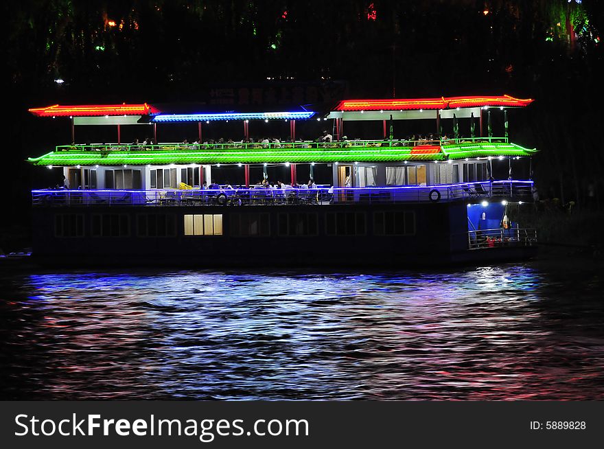 Night scene on the river, lighten the boat