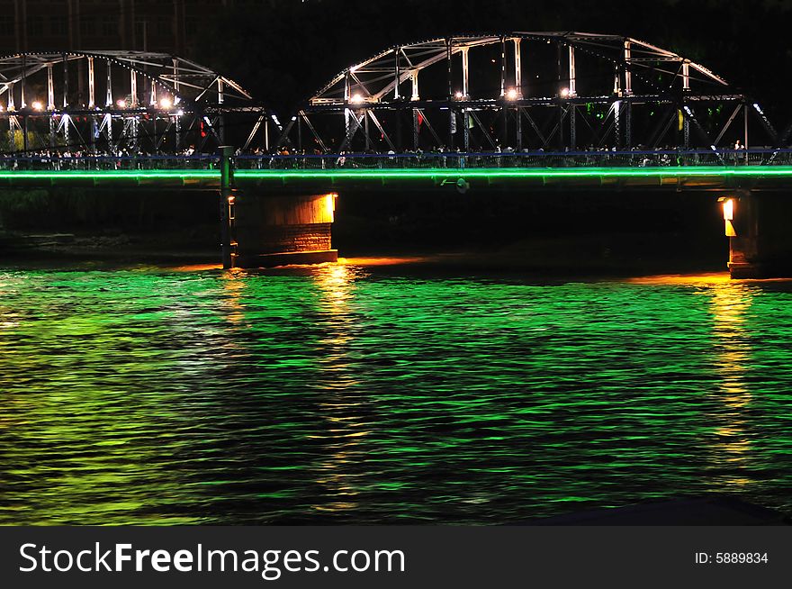 Night scene on the river, steel bridge
