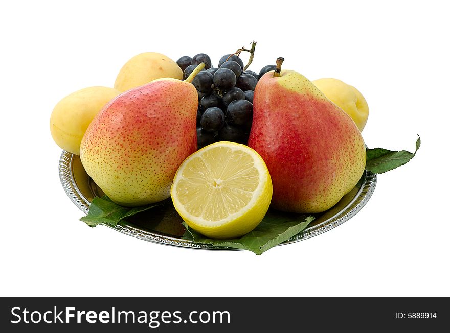 Fruit on a dish on a white background. Fruit on a dish on a white background