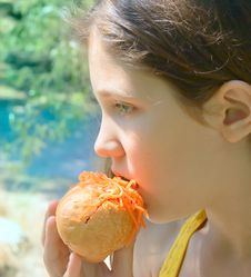 Fun Girl Eat Hot-dog On Nature Background Royalty Free Stock Photo
