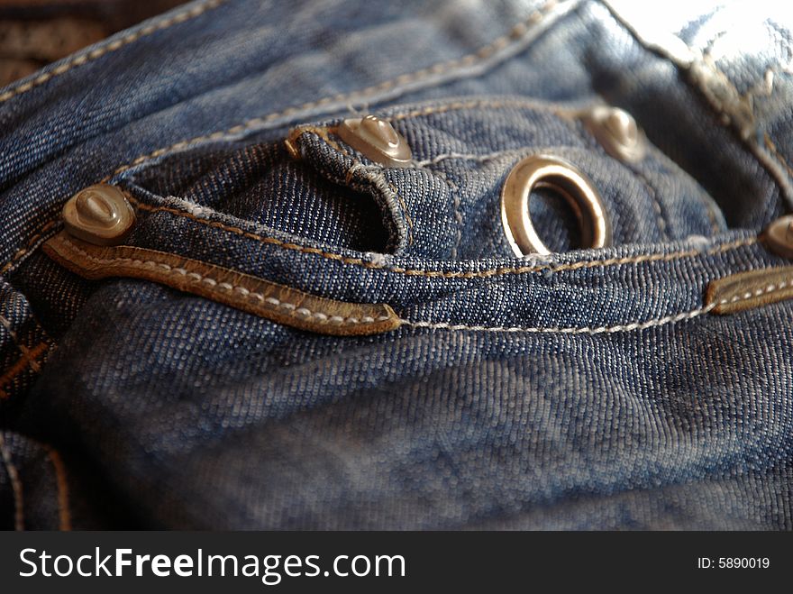 Pocket of blue jeans with buttons. Pocket of blue jeans with buttons
