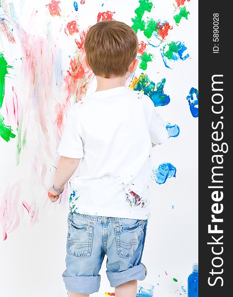 Child Painting On The Wall