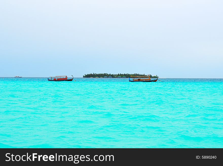 Island of Paradise. White sand beaches with coco-tree and crystal blue water. Maldives. Luxury holidays. Island of Paradise. White sand beaches with coco-tree and crystal blue water. Maldives. Luxury holidays.