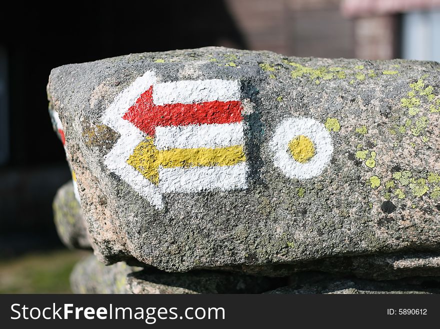 Tourist trail painted on the rock, orientation, tourism