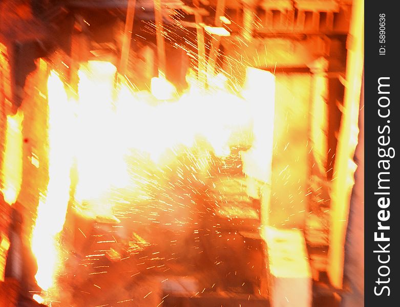 Glowing, molten hot steel. Stell casting. Glowing, molten hot steel. Stell casting.