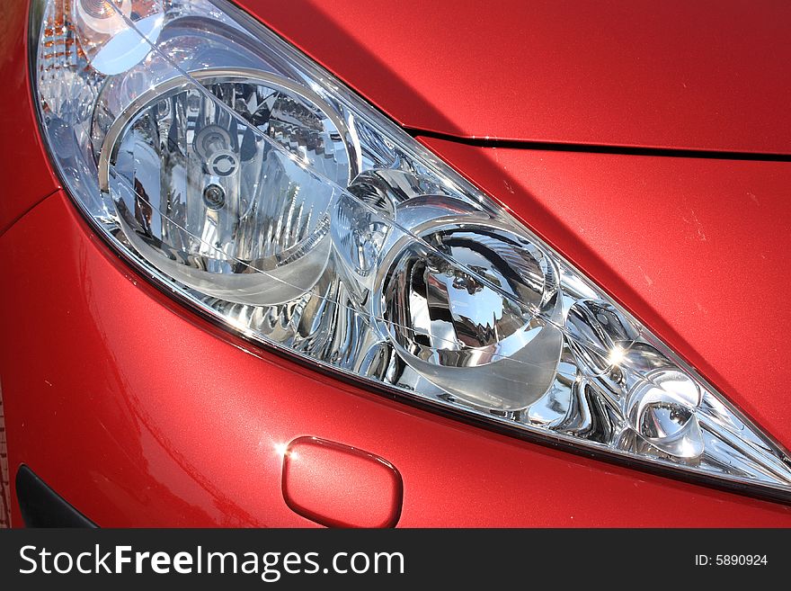 Beautiful eyes red car. light